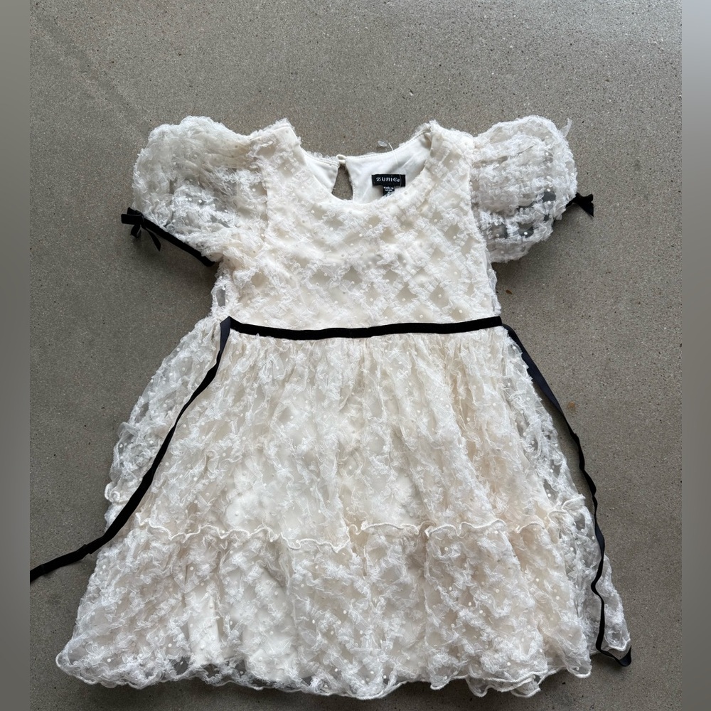 KIDS' RUFFLE PUFF SLEEVE MESH DRESS IN IVORY/ BLACK by Zumiez size 5.